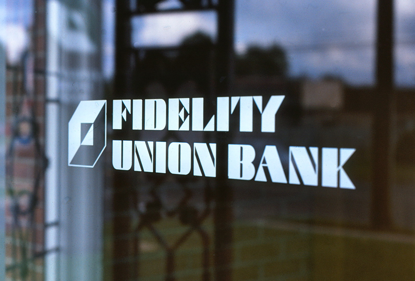 Fidelity Union Bank and logo mounted to a large glass window with white vinyl diecuts.