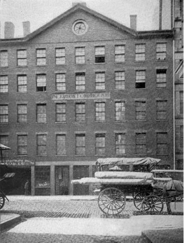 An old image of the Boston Customs House with a horse and carriage in front of it, taken 1904 or earlier.