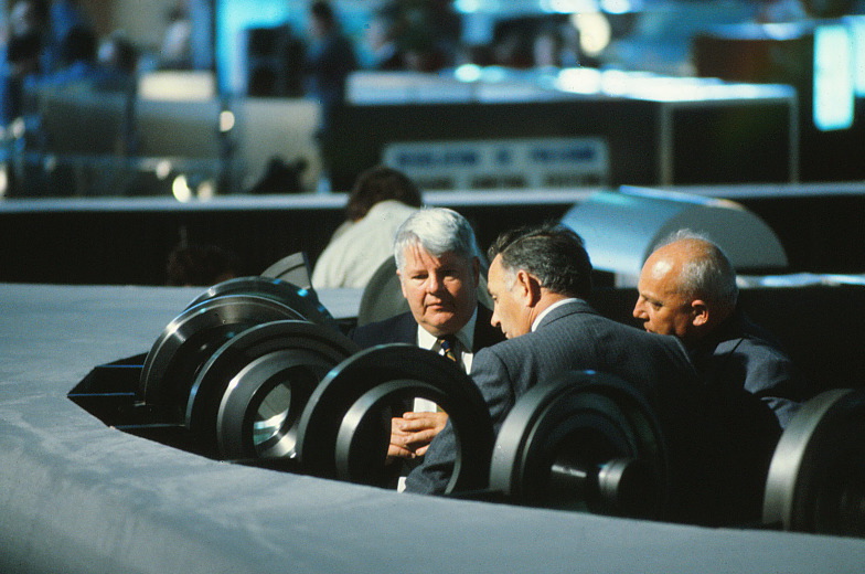 People touching the products and closely inspecting them.