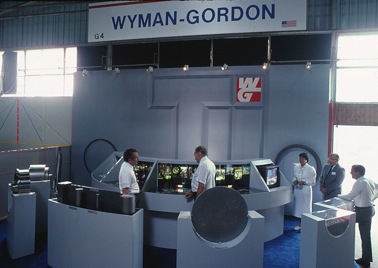 Photograph of the finished exhibit with people standing in it.