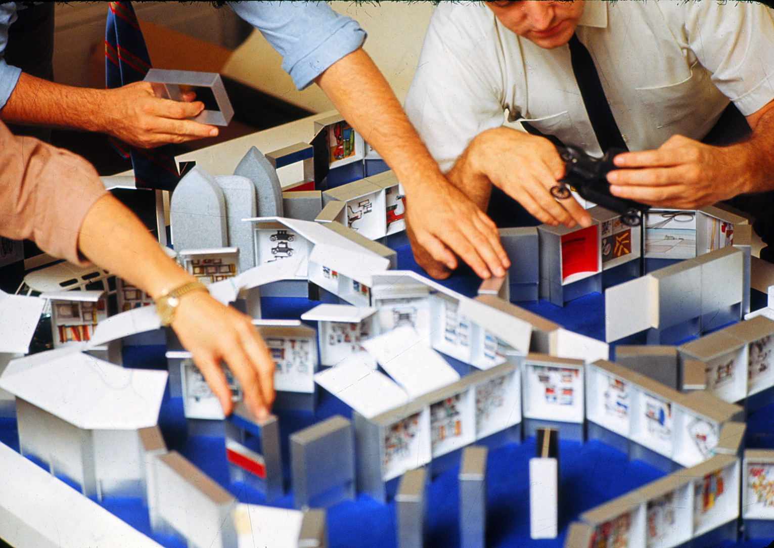 Employees at George Nelson office asembly model of the exhibit