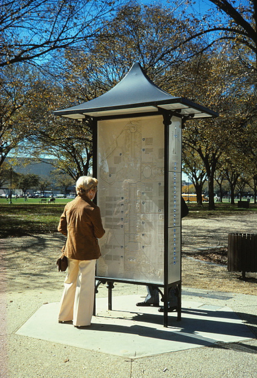 woman looking at kiosk